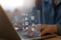 A woman using a laptop computer is chatting with a smart artificial intelligence and asking for the answers he needs
