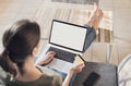 Woman using laptop computer and credit card at home. Businesswoman, entrepreneur working Royalty Free Stock Photo