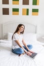 Woman Using Laptop Computer Lying On Bed. Closeup Portrait Of Happy Beautiful Girl Typing On Notebook Keyboard, Working Online At