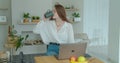 Woman using laptop computer. Portrait of business woman watching news at laptop screen and drinking coffee at home Royalty Free Stock Photo