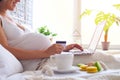 Woman using laptop computer for shopping online with credit card Royalty Free Stock Photo