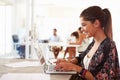 Woman Using Laptop In Modern Office Of Start Up Business Royalty Free Stock Photo