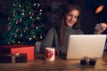 Woman using laptop, shopping online, using credit card at home. Royalty Free Stock Photo