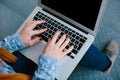 Woman using laptop while sitting on stairs Royalty Free Stock Photo