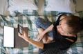 woman using laptop or tablet in bed white empty screen for copy space Royalty Free Stock Photo
