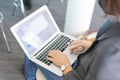 woman using a laptop taking notes during a seminar presentation Royalty Free Stock Photo