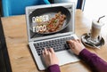 Woman using laptop to order food delivery online Royalty Free Stock Photo