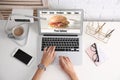 Woman using laptop to order food delivery Royalty Free Stock Photo