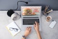 Woman using laptop to order food delivery at table Royalty Free Stock Photo