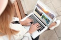 Woman using laptop to plan trip. Travel agency website