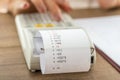 Woman using a manual adding machine Royalty Free Stock Photo