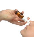 Woman using medicine nose spray nasal isolated