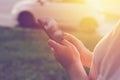 Woman using mobile phone app to call taxi cab Royalty Free Stock Photo