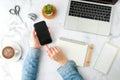 Woman using mobile phone application with computer laptop. flat lay and modern style Royalty Free Stock Photo