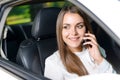 Woman using mobile phone in car Royalty Free Stock Photo