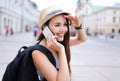 Woman using mobile phone on city street Royalty Free Stock Photo