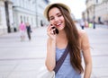 Woman using mobile phone on city street Royalty Free Stock Photo