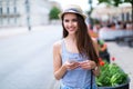 Woman using mobile phone on city street Royalty Free Stock Photo