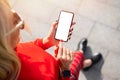 Woman using mobile phone with  empty white mockup screen Royalty Free Stock Photo