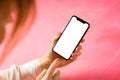 Woman using mobile phone with empty white screen, mockup for your app design Royalty Free Stock Photo
