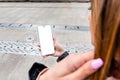 Woman using mobile phone with empty white screen, mockup for your app design.Mobile app mockup.Woman showing smartphone with blank Royalty Free Stock Photo