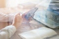 Woman using mobile phone in office workplace Royalty Free Stock Photo