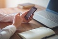 Woman using mobile phone in office workplace Royalty Free Stock Photo