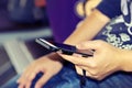 Woman using mobile phone in office workplace. Royalty Free Stock Photo