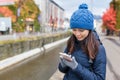 Woman using mobile phone at otaru city