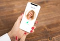 Woman using mobile phone`s facial recognition technology Royalty Free Stock Photo