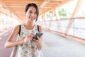 Woman using mobile phone in the street Royalty Free Stock Photo