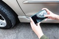Woman using a mobile phone Take photos of the damage of the car Royalty Free Stock Photo