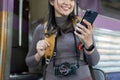 Woman using mobile phone while travel by train. travel concept Royalty Free Stock Photo