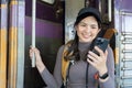 Woman using mobile phone while travel by train. travel concept Royalty Free Stock Photo