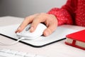 Woman using modern optical mouse at office table, closeup Royalty Free Stock Photo