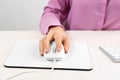 Woman using modern wired optical mouse at table, closeup Royalty Free Stock Photo