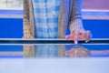 Woman using multimedia touchscreen display of interactive kiosk at exhibition