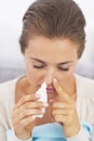 Woman using nasal drops Royalty Free Stock Photo