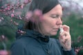 Woman using nasal spray outdoors Royalty Free Stock Photo