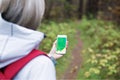 Woman using navigation app on smartphone Royalty Free Stock Photo