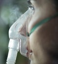 Woman using nebuliser mask Royalty Free Stock Photo