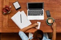 Woman Using Notebook Computer, Taking Notes At Cafe. Working. Royalty Free Stock Photo