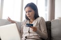 Woman using online banking having problem with blocked credit card Royalty Free Stock Photo