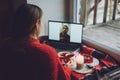 Woman using online dating app on laptop. Valentines Day, dating, meeting During The Coronavirus Outbreak. Love at Royalty Free Stock Photo