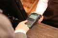 Woman using payment terminal at shop Royalty Free Stock Photo