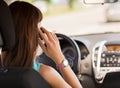 Woman using phone while driving the car Royalty Free Stock Photo