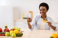 Woman Using Phone Grocery Shopping Application Holding Credit Card Indoor Royalty Free Stock Photo