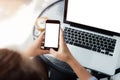 Woman using phone on work table