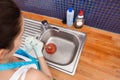 Woman using plunger Royalty Free Stock Photo