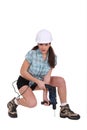 Woman using a power tool Royalty Free Stock Photo